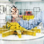 electrical engineer draws a diagram of a circuit